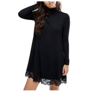 Black turtleneck mini dress with lace trim